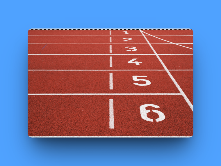 Numbered lanes on a running track viewed from the starting line.